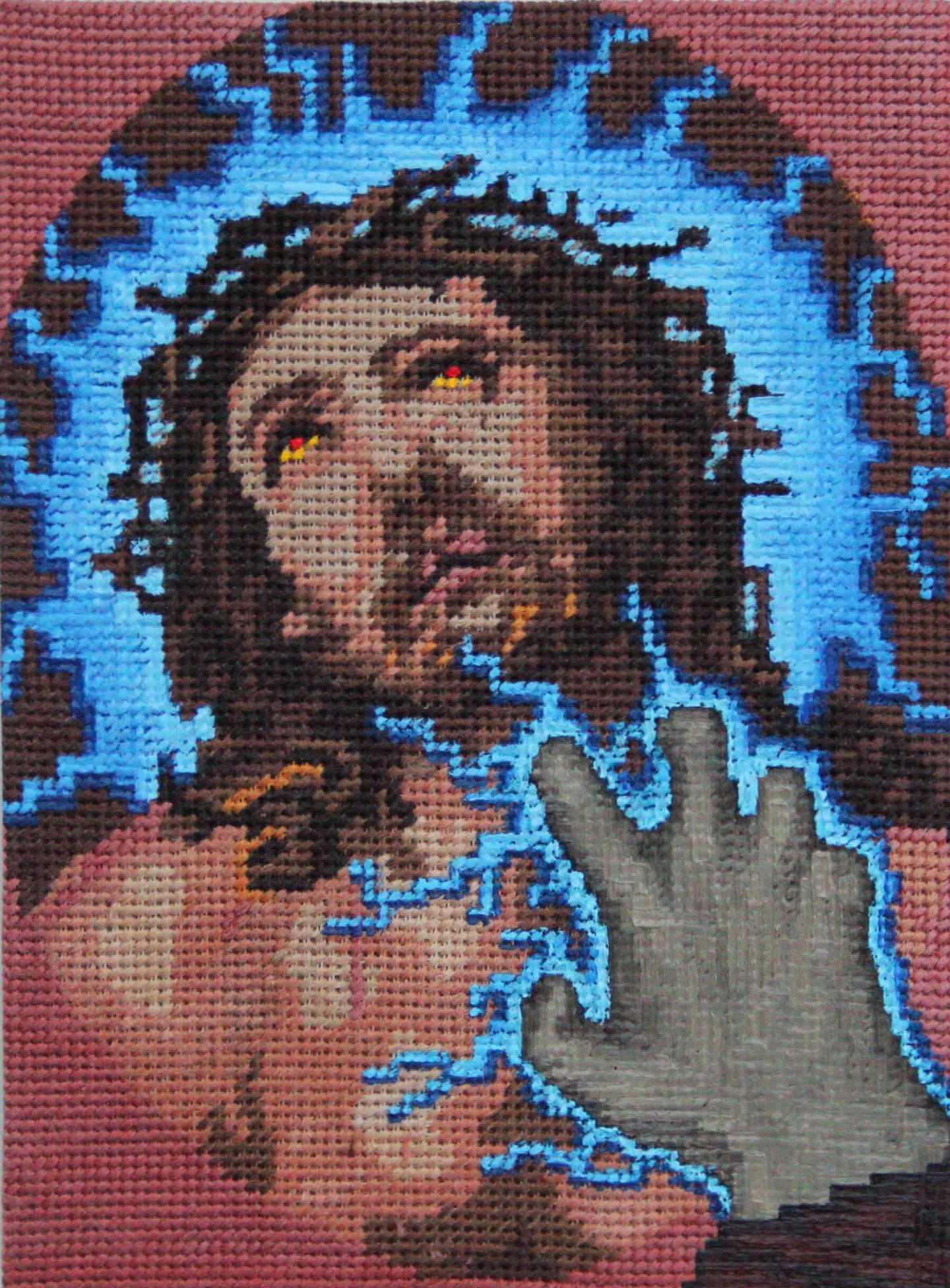 Vojtěch Luksch blends violent retro video games with the “grandma-core” of embroidered canvases